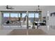 Bright and modern kitchen with large sink, quartz countertops, and open layout to dining and living areas at 23282 S 229Th Pl, Queen Creek, AZ 85142
