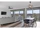 Open-concept living area with modern furniture, laminate flooring, and large windows providing ample natural light at 23282 S 229Th Pl, Queen Creek, AZ 85142