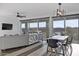 Open-concept living and dining area with bright, natural light and modern furnishings at 23282 S 229Th Pl, Queen Creek, AZ 85142