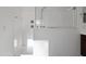 Modern white tiled shower featuring glass enclosures and chrome fixtures at 23282 S 229Th Pl, Queen Creek, AZ 85142