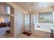 Bright bathroom with a glass-enclosed shower and large soaking tub under a window at 2528 W Mericrest Way, San Tan Valley, AZ 85144