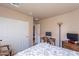 Neutral bedroom featuring closet, simple desk and a minimal decor at 2528 W Mericrest Way, San Tan Valley, AZ 85144