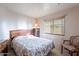 Simple bedroom with light walls, a window, and minimal decorations at 2528 W Mericrest Way, San Tan Valley, AZ 85144