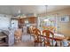 Bright dining room with eat in bar, access to the outdoor patio and the kitchen space at 2528 W Mericrest Way, San Tan Valley, AZ 85144