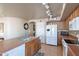 Bright kitchen with a breakfast bar and island, and ample storage space at 2528 W Mericrest Way, San Tan Valley, AZ 85144