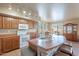 Spacious kitchen with stainless sink, a microwave and cook top oven and ample counter space at 2528 W Mericrest Way, San Tan Valley, AZ 85144