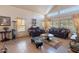 Cozy living room with comfortable seating, bright ambiance, and tile floors at 2528 W Mericrest Way, San Tan Valley, AZ 85144