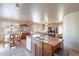Open floor plan with dining area, living space, and large windows, ideal for entertaining at 2528 W Mericrest Way, San Tan Valley, AZ 85144