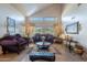 Bright living room with high ceilings, decorative furniture, and large windows at 2528 W Mericrest Way, San Tan Valley, AZ 85144