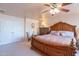 Spacious main bedroom features a ceiling fan, a closet and neutral tones at 2528 W Mericrest Way, San Tan Valley, AZ 85144