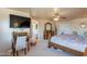 Large main bedroom showcasing furniture, ceiling fan, and access doorway at 2528 W Mericrest Way, San Tan Valley, AZ 85144