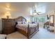 Warm and inviting main bedroom with a ceiling fan and natural lighting at 2528 W Mericrest Way, San Tan Valley, AZ 85144
