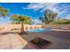 Inviting backyard pool surrounded by a tiled patio and lush landscaping at 2528 W Mericrest Way, San Tan Valley, AZ 85144