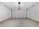 Spacious garage with white walls and concrete floor at 26007 N 160Th Ln, Surprise, AZ 85387