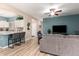 Bright living room offering a view of the modern kitchen, creating a harmonious and inviting space at 2801 N Litchfield Rd # 72, Goodyear, AZ 85395