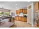 Well-equipped kitchen with wooden cabinetry and modern appliances at 30789 N Raindance Rd, San Tan Valley, AZ 85143