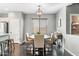 Cozy dining area featuring a modern light fixture, round table, and neutral color palette at 3475 E Pinot Noir Ave, Gilbert, AZ 85298