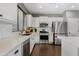 Beautiful kitchen featuring stainless steel appliances, a subway tile backsplash, and a large sink at 3475 E Pinot Noir Ave, Gilbert, AZ 85298