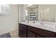 Bathroom features double sinks and a large mirror at 35421 W San Alvarez Ave, Maricopa, AZ 85138