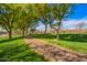 Community park with open green spaces, trees, and historic railroad tracks at 3650 W Mccauley Ct, Phoenix, AZ 85086