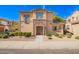 Inviting two-story home with stone accents and manicured landscaping at 3650 W Mccauley Ct, Phoenix, AZ 85086