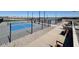 A pickleball area in the community with multiple courts, benches and lighting at 36820 W San Clemente St, Maricopa, AZ 85138