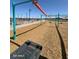 Community playground features a modern play structure with slide and plenty of room to run around at 36820 W San Clemente St, Maricopa, AZ 85138