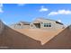 Large backyard with privacy wall offers potential for creating an outdoor oasis at 37053 W La Paz St, Maricopa, AZ 85138