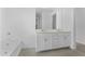 Bathroom featuring double sinks, a soaking tub, and modern fixtures at 37053 W La Paz St, Maricopa, AZ 85138