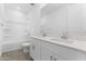 Bathroom featuring double sinks, shower over tub, and modern finishes at 37053 W La Paz St, Maricopa, AZ 85138