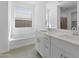 Bright bathroom featuring double sinks, a soaking tub, and a large mirror at 37053 W La Paz St, Maricopa, AZ 85138