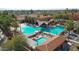 Stunning community pool area featuring lounge chairs, shade canopies, and mature trees, perfect for recreation and relaxation at 3777 N 162Nd Ave, Goodyear, AZ 85395