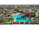Resort-style pool area with lounge chairs, mature palm trees, and shaded seating offering relaxation and recreation at 3777 N 162Nd Ave, Goodyear, AZ 85395