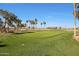 Scenic view of a meticulously maintained golf course with mature trees and lush fairways at 3777 N 162Nd Ave, Goodyear, AZ 85395