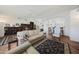 Inviting living room with a large sofa and an area rug on top of wood floors at 3777 N 162Nd Ave, Goodyear, AZ 85395