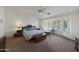 Spacious main bedroom with a large window offering ample natural light at 3777 N 162Nd Ave, Goodyear, AZ 85395