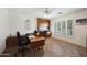 Well-lit home office with built-in desk and view to a shuttered window at 3777 N 162Nd Ave, Goodyear, AZ 85395