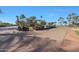 Golf cart parking lot with ample space, surrounded by palm trees and well-kept grounds at 3777 N 162Nd Ave, Goodyear, AZ 85395
