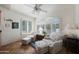 Bright sitting area with plantation shutters, tile floors, and comfortable chairs at 3777 N 162Nd Ave, Goodyear, AZ 85395