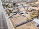 Overhead view of a multi-acre lot featuring a home, several outbuildings, horse arena and mature landscaping at 4302 W Dobbins Rd, Laveen, AZ 85339