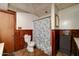 Functional bathroom featuring a toilet, shower, and a storage cabinet at 4302 W Dobbins Rd, Laveen, AZ 85339