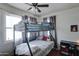 This bedroom features a bunk bed with a ceiling fan at 4302 W Dobbins Rd, Laveen, AZ 85339