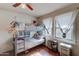 This bedroom has a bunk bed next to bright sunny windows at 4302 W Dobbins Rd, Laveen, AZ 85339