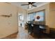 Cozy dining room with a ceiling fan and a window with decorative curtains at 4302 W Dobbins Rd, Laveen, AZ 85339