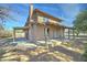 Rear view of a charming home featuring a covered porch and yard at 4302 W Dobbins Rd, Laveen, AZ 85339