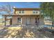Charming two-story home with a covered porch and stucco exterior at 4302 W Dobbins Rd, Laveen, AZ 85339