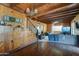 Spacious living room featuring wood floors, stairs, and a decorative chandelier at 4302 W Dobbins Rd, Laveen, AZ 85339
