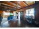 Cozy living room with wood paneling, hardwood floors and ample natural light at 4302 W Dobbins Rd, Laveen, AZ 85339