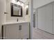 Bathroom featuring a white vanity with framed mirror and modern light fixture above at 5704 E Aire Libre Ave # 1217, Scottsdale, AZ 85254