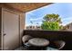 Comfortable balcony with outdoor furniture and scenic neighborhood views at 5877 N Granite Reef Rd # 2203, Scottsdale, AZ 85250